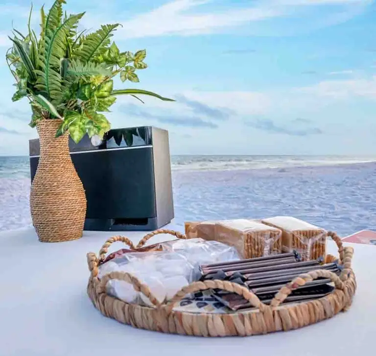 A gourmet s'mores package basket on the sand for a beachside bonfire in Santa Rosa Beach along 30A.